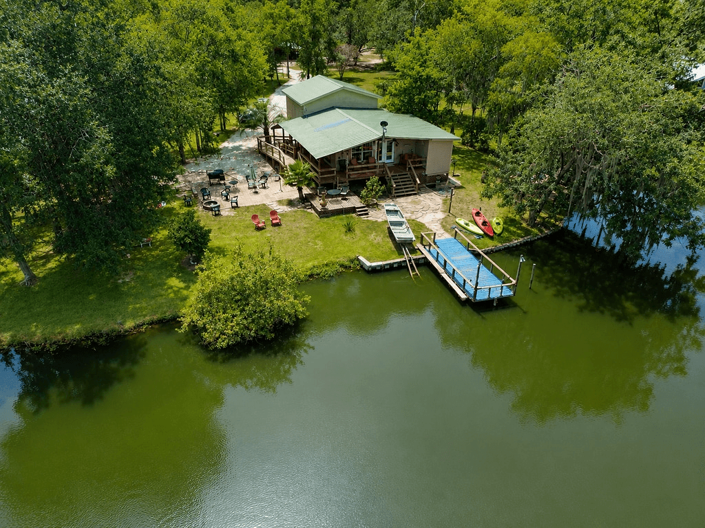 Your own peaceful lakeside retreat—complete with private dock, kayaks, fire pit, outdoor gathering spaces, and plenty of room to relax right on the water.
